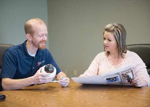 Tech explaining Smart Home Security Cameras