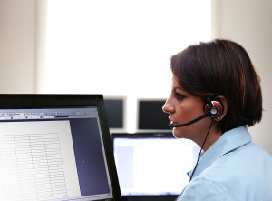 a woman working at a public safety answering point call center during the daytime