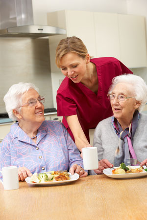 elderly people being served food