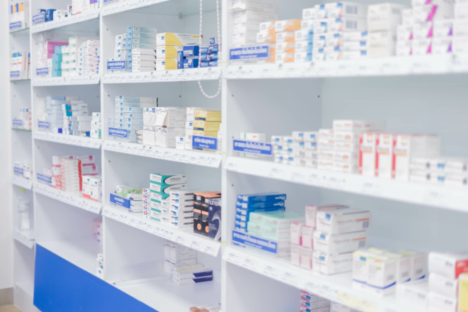 Medicines arranged in shelves, Pharmacy drugstore retail Interior blur abstract backbround with healthcare product on medicine cabinet.