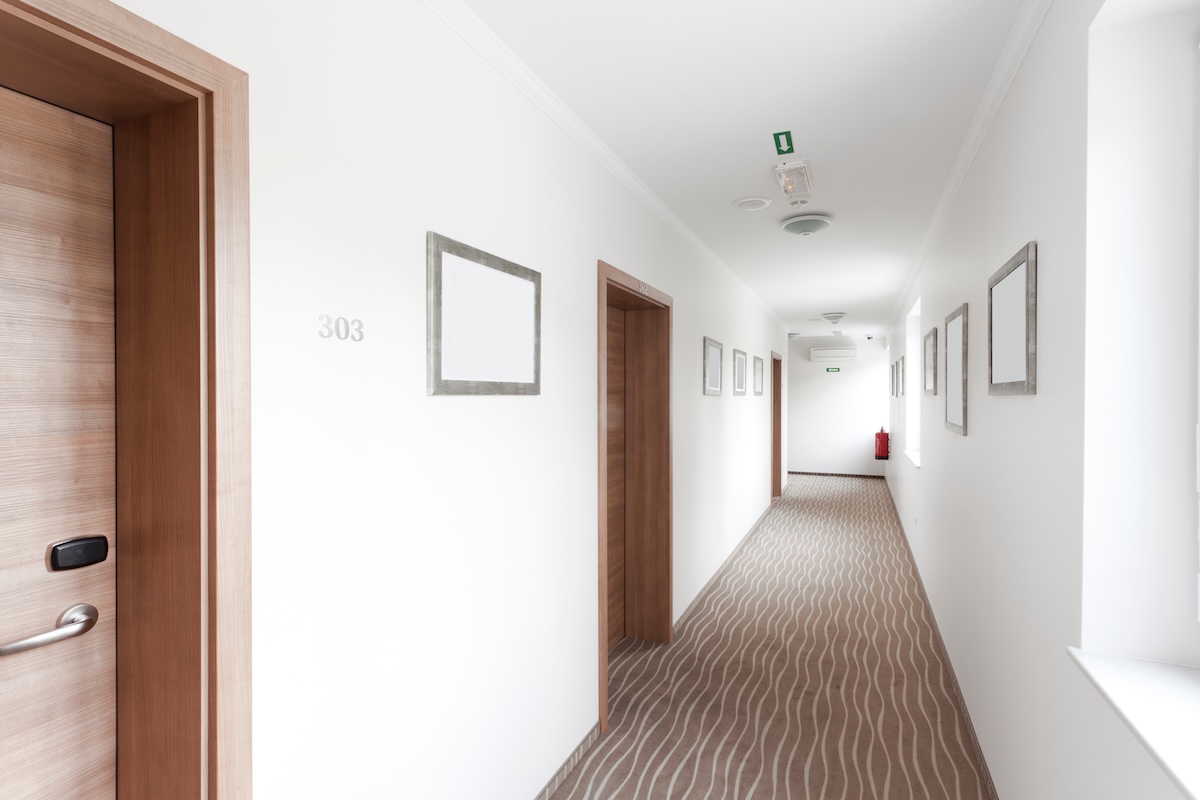 Hotel corridor with smoke detector and fire safety features