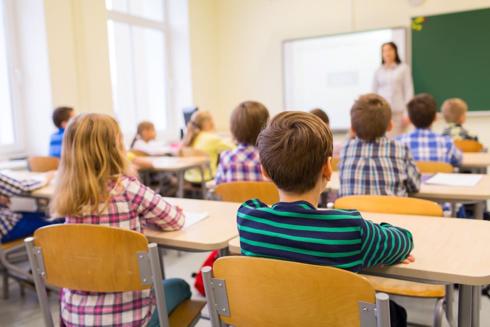 Elementary-aged students learning in a safe school environment.
